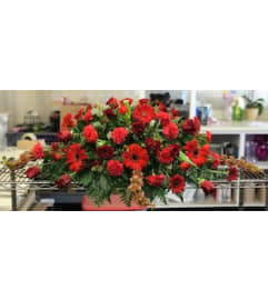 Red Is The Name Casket Spray. An arrangement by Massey's House of Flowers.