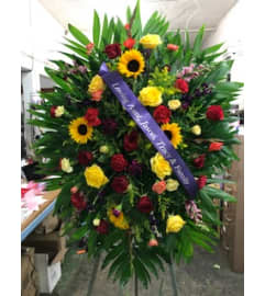 Sunshine Away Standing Spray. An arrangement by Massey's House of Flowers.