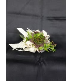 Wedding or prom Burlap and Succulents Corsage. An arrangement by Timp Valley Floral. Wedding or prom Burlap and Succulents Corsage. An arrangement by Timp Valley Floral.