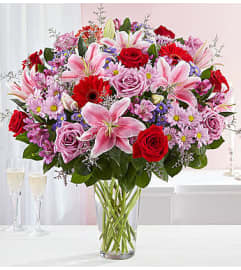 The Adoring Love Bouquet In Vase. An arrangement by Aventura Blooming Petals.