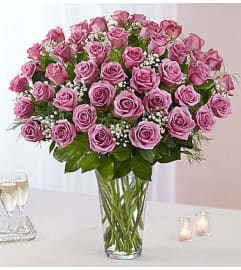 Ultimate Elegance 60 Long Stem Lavender Roses. An arrangement by Aventura Blooming Petals.