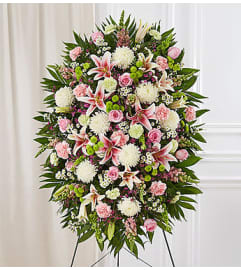 Pastel Sympathy Standing Spray. An arrangement by Brickell Ave Florist. Pastel Sympathy Standing Spray. An arrangement by Brickell Ave Florist.