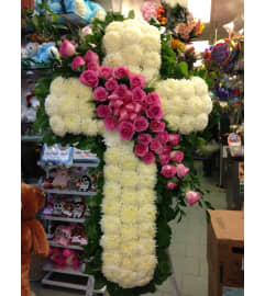 sympathy standing cross. An arrangement by Elegant Florist.