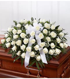 White Rose Casket Cover. An arrangement by Elegant Florist.