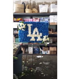 LA Dodger funeral spray. An arrangement by Commerce Flowers.