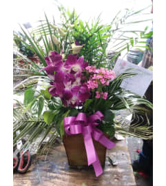 garden tin. An arrangement by Commerce Flowers.