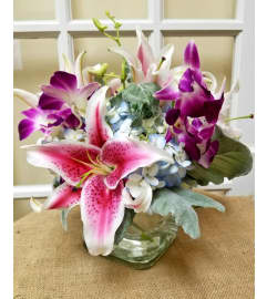 Lily and Orchid Delight Bouquet. An arrangement by Flowers of Jacksonville.