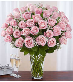Pink Roses Four Dozen. An arrangement by Lovingly Charlotte.