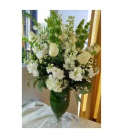 The White Buffet Arrangement. An arrangement by Flowers of Jacksonville.