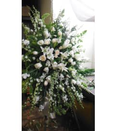 lovingly white standing spray. An arrangement by Commerce Flowers.