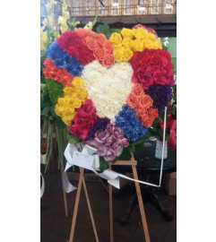 My Rainbow heart. An arrangement by Commerce Flowers.