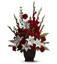 Tender Tribute. An arrangement by Flowers of Jacksonville.