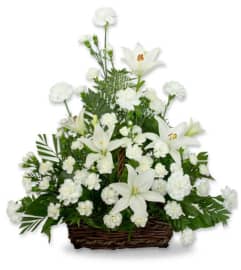 Serene Lily Basket. An arrangement by Seasons Change Designs.