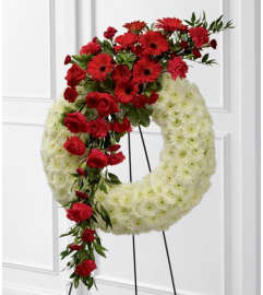 Graceful Tribute Wreath. An arrangement by Seasons Change Designs.