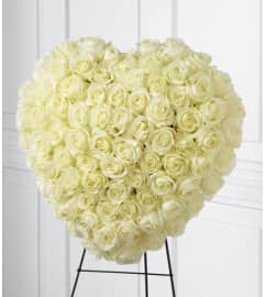 Elegance Remembrance. An arrangement by Seasons Change Designs.