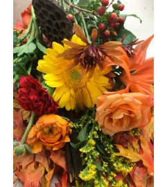 DESIGNER CHOICE HAND-CRAFTED FALL CENTERPIECE. An arrangement by Floral Boutique.