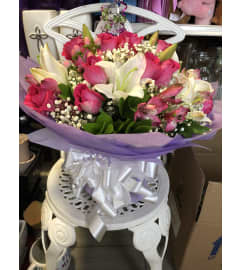 Opening Hand-Tied bouqet. An arrangement by Flamingo Floral and Gifts. Opening Hand-Tied bouqet. An arrangement by Flamingo Floral and Gifts.