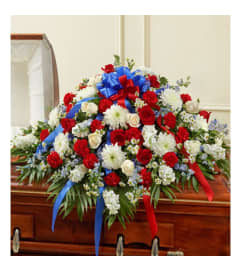 Red, White and Blue Casket Spray. An arrangement by Elegant Florist.