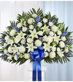 The Heartfelt Sympathies Standing Basket - Blue and White XL. An arrangement by Flowers of Jacksonville.