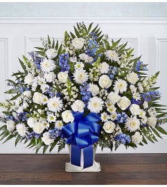 The Heartfelt Tribute Floor Basket - Blue and White XL. An arrangement by Flowers of Jacksonville.