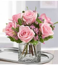 6 CLASSIC PINK ROSES. An arrangement by Howard Beach Florist.