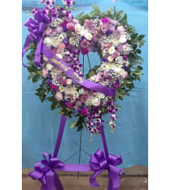LOVING HEART TRIBUTE. An arrangement by Howard Beach Florist.