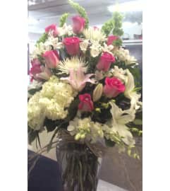 PINK SENSATION. An arrangement by Howard Beach Florist. PINK SENSATION. An arrangement by Howard Beach Florist.