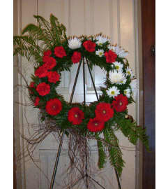 Red and White Wreath Spray. An arrangement by Doyle's Flower Shop.