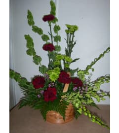Crimson and Clover. An arrangement by Doyle's Flower Shop.
