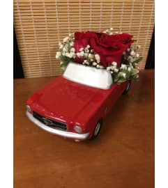 Red '65 Ford Mustang. An arrangement by K1 Floral Studio.
