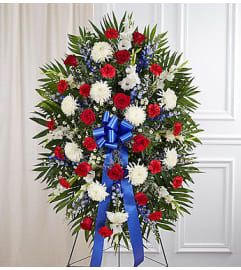 Red, White and Blue Standing Spray. An arrangement by Elegant Florist.