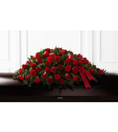 Forever in our Hearts Casket Spray. An arrangement by Flowers of Jacksonville.