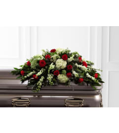A Sincerity Casket Spray. An arrangement by Flowers of Jacksonville.