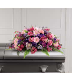The Glorious Garden™ Casket Spray. An arrangement by Flowers of Jacksonville.