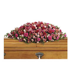 The A Life Loved Casket Spray. An arrangement by Flowers of Jacksonville.