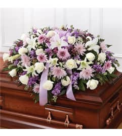 Sympathy Lavender Half Casket Cover. An arrangement by Burlington Flowers.