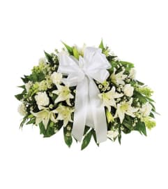Sympathy All White Half Casket Cover. An arrangement by Burlington Flowers.