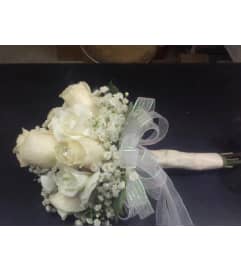 HAND TIED BOUQUET OF ROSES. An arrangement by Howard Beach Florist.