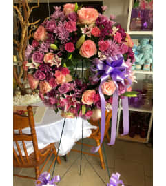 Lavender and Rose Sympathy Wreath. An arrangement by Sonia's Florist.