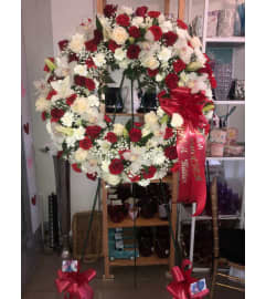 Forever in Our Hearts Wreath. An arrangement by Sonia's Florist.
