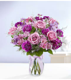PURPLE SHADES. An arrangement by J.D. Ballantine's Flowers and Gifts.