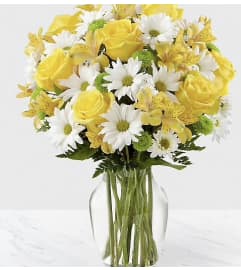 Its Bright and Yellow. An arrangement by Seasons Change Designs.