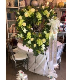 Peaceful Heart Standing Wreath. An arrangement by Sonia's Florist.