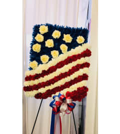 Patriotic Tribute Spray. An arrangement by Sonia's Florist.