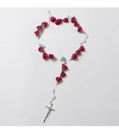 18 ROSEBUD ROSARY. An arrangement by Flowers by Priscilla.