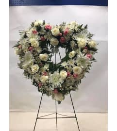 SERENITY HEART. An arrangement by White's Flowers.
