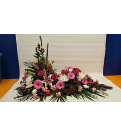 SUMMERS DAY URN SPRAY. An arrangement by White's Flowers.
