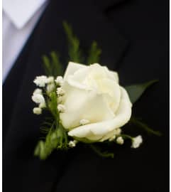 ROSE BOUTONNIERE TO MATCH DATE'S FLOWERS.. An arrangement by Flowers by Priscilla.