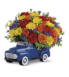Ford Pickup Full Of Flowers. An arrangement by K1 Floral Studio.