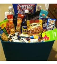 candy basket fl. An arrangement by Flowers 4 U Helping Hand.